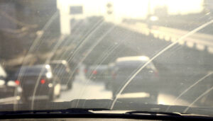 Dirty windscreen reducing summer driving visibility